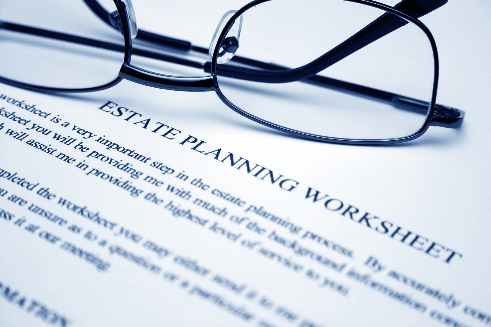Glasses on an business planning worksheet. 